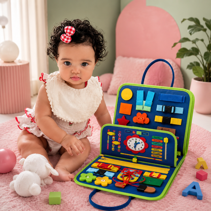 Baby girl playing with Montessori busy board fine motor skills activity